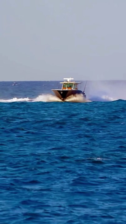 Visually pleasing Scout Power boat entering the Haulover Inlet in Miami, Florida