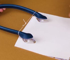 Creating fancy handbag out of simple paper one!