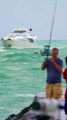 Police help person from jetski accident on Crazy Sunday as large yacht enters at the Haulover Inlet in Bal Harbour, Florida