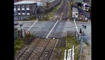 Train narrowly misses man on level crossing