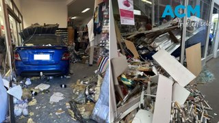Car narrowly misses shoppers after plunging into window near Newcastle, NSW