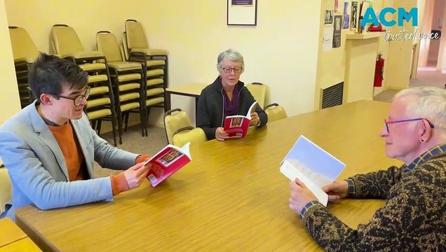 Booranga Writers Centre committee members reading poetry as funding dries up