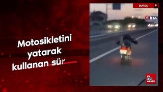 Bursa'da motosikletini yatarak kullanan sürücü