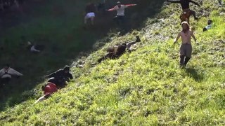 Watch: Daredevils tumble down Cooper’s Hill for annual Gloucester cheese rolling race