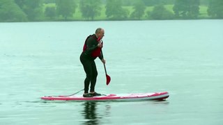 UK Liberal Democrat leader Ed Davey falls off paddle board