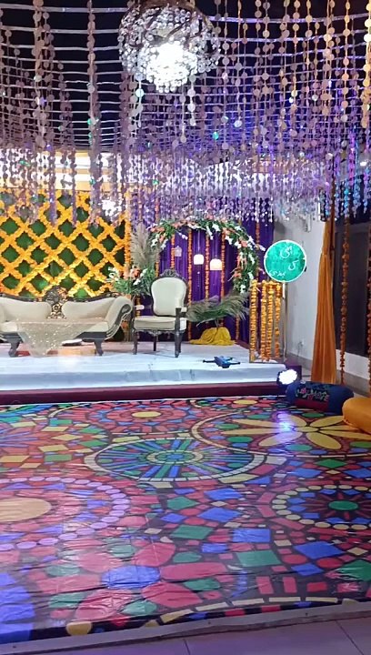 Mehndi yellow themes bridal stage decor yellow flowers stage droneshoot video.