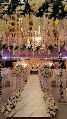 Banquets entrance decor flowers white chair setup.