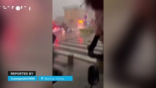 Hurricane-force winds cause havoc in Beijing, China