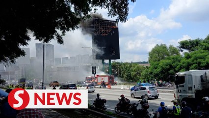 Billboard along Federal Highway catches fire