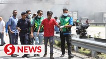 Nine foreign workers rescued from burning billboard along Federal Highway