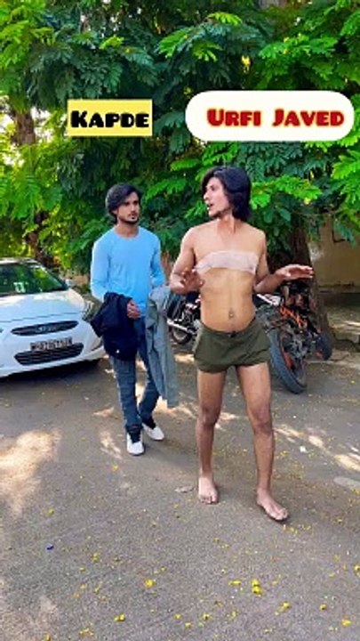 Funny  bikini  boy walking on road