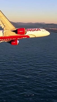 Air india flying over a sea