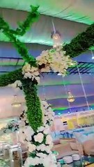 Banquets entrance decor white flowers and bridle stage full flower work view.