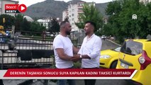 Derenin taşması sonucu suya kapılan kadını taksici kurtardı