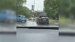 Sofa flies off roof of car and onto busy roundabout