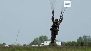 Mass parachute jump over Normandy kicks off D-Day commemorations - but Putin is not invited