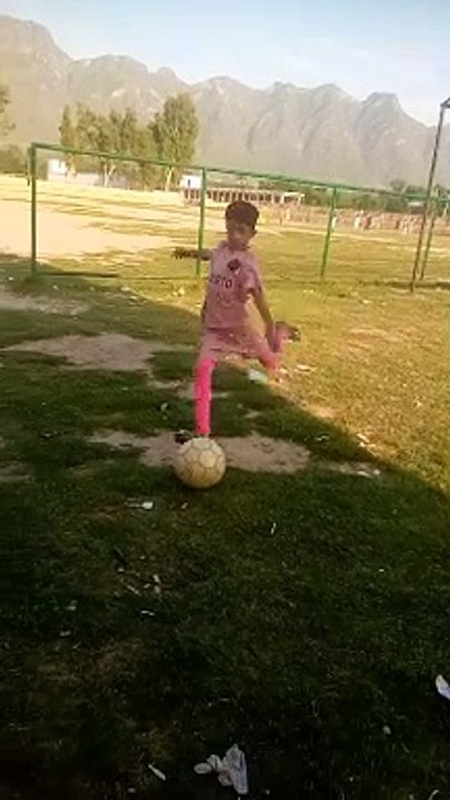 Cute shooter of football player