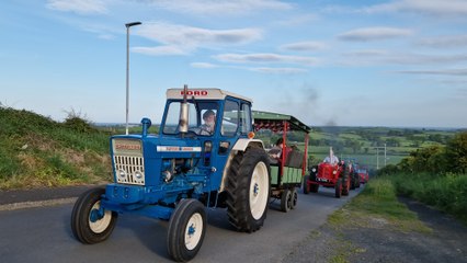 Tractors make their way up Windmill Road during the St Columba's College tractor run at Portaferry, Co Down