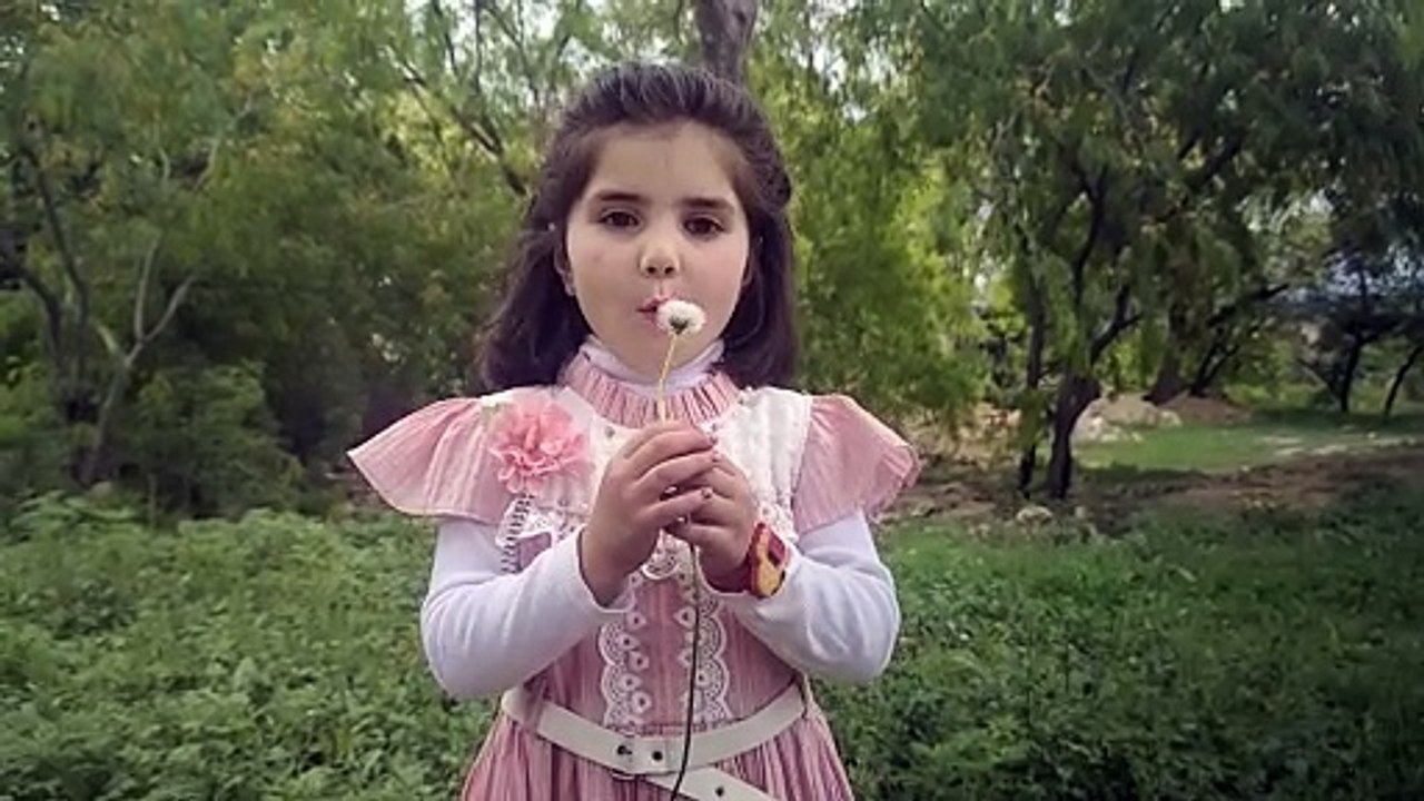 Kid enjoy flower