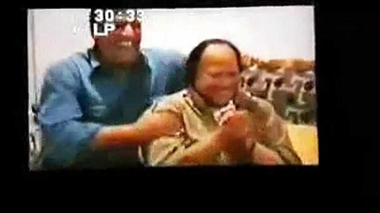Haji Sab playing Harmonium