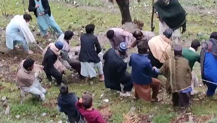 people sliding heavy stone 