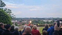 Crowds in Lisburn sing the National Anthem as the D-Day 80 beacon is lit