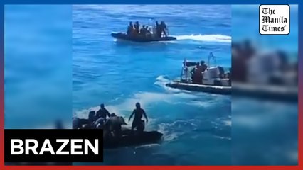 Chinese Coast Guard personnel harass Filipinos securing airdropped supplies