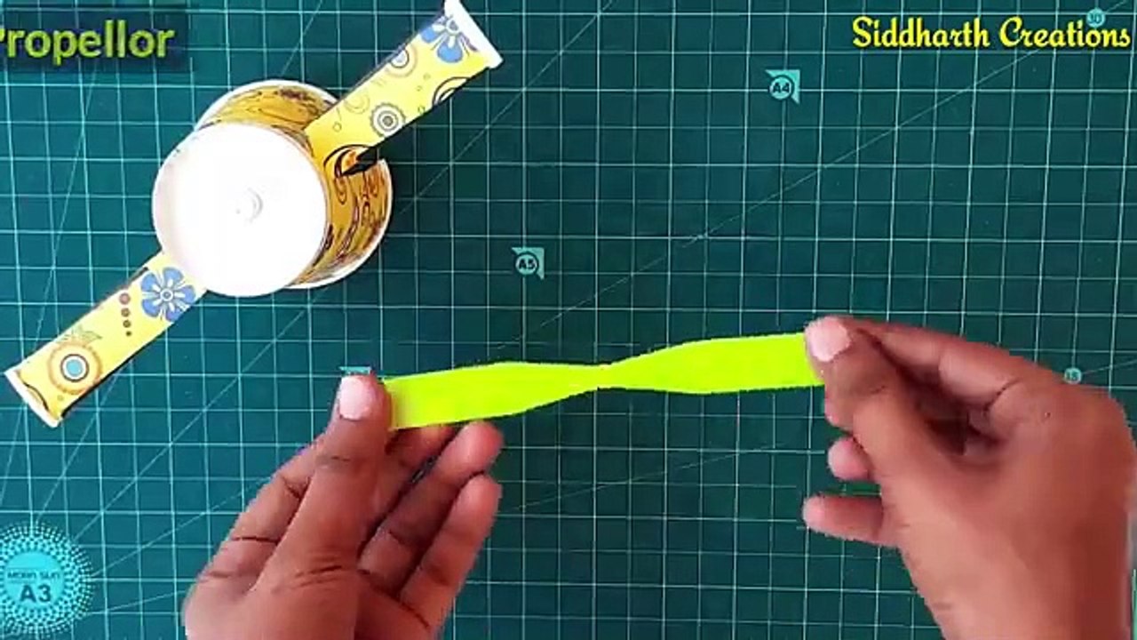 How to make Paper cup Helicopter - Rubber band powered flying plane ...