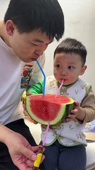 Eating watermelon juice baby boy