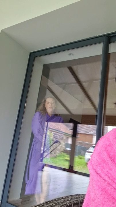 Woman Walks Into Glass Door