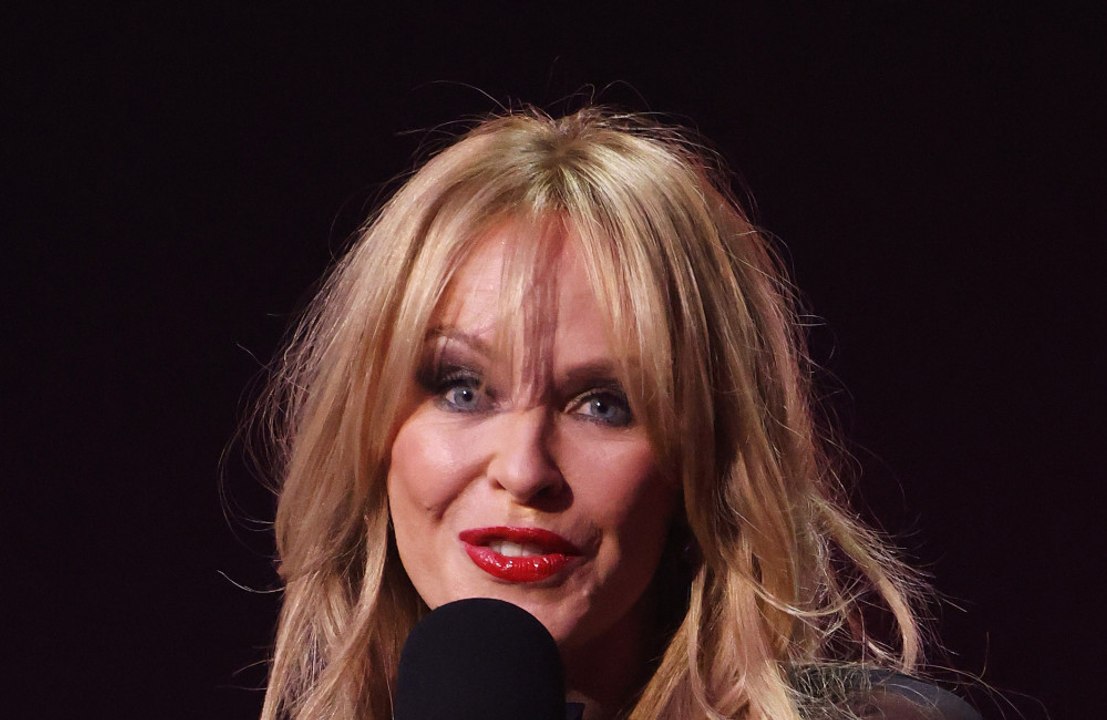 Kylie Minogue says she and Madonna have 'both survived the ups and downs of being a woman' in showbusiness