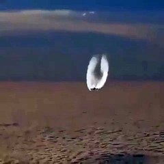 The plane in the air was filmed from another plane