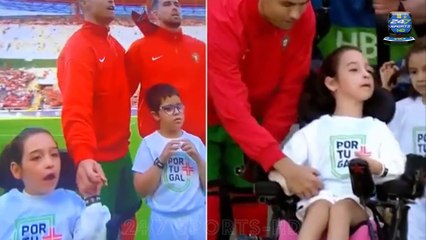 Heartwarming moment Cristiano Ronaldo helps a disabled child onto the pitch before Portugal's Euro 2024 warm-up clash against Ireland... before Al-Nassr star holds her hand throughout the national anthem