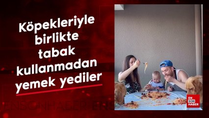 Köpekleriyle birlikte tabak kullanmadan yemek yediler
