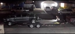 Truck Rolls Off Trailer and Hits Another Truck Behind it