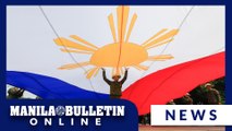 Soldiers raise flag at Rizal Monument for Independence day rehearsal