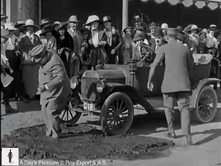Charlie Chaplin trapped in tar - A Day's Pleasure (1919)