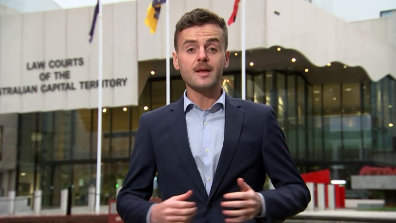 Man charged with forcible confinement, sexual assault after woman allegedly found running naked and screaming along Canberra street