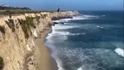 Stranded kite surfer rescued after using rocks to spell "HELP"