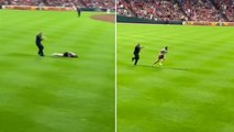 Baseball fan does backflip on field before being tased by police officer