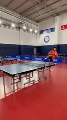 Guy Plays Table Tennis by Kicking the Ball Back