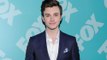 Chris Colfer found the early days of 'Glee' to be a 'very gruelling process'