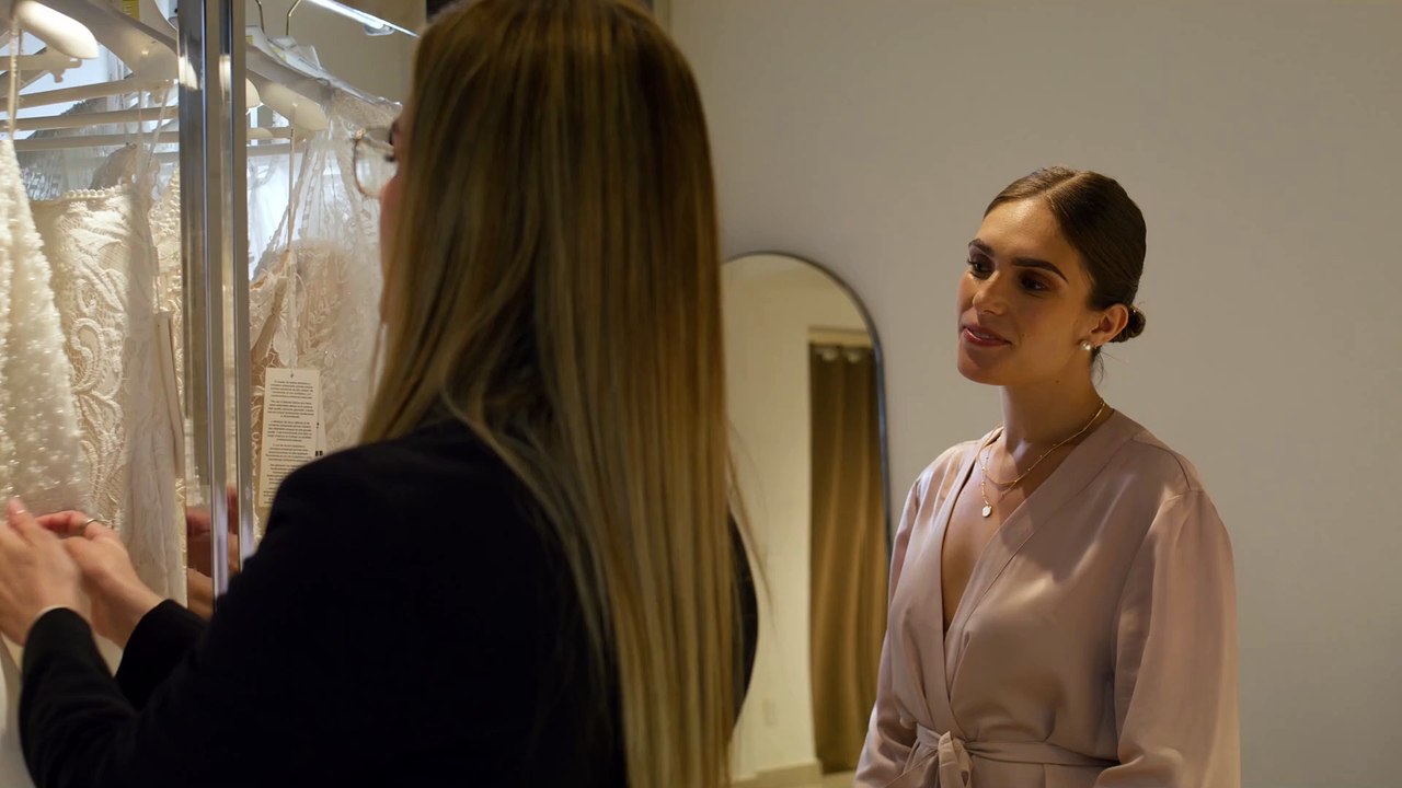 mixkit-a-young-sales-woman-show-the-details-and-fabric-of-51216