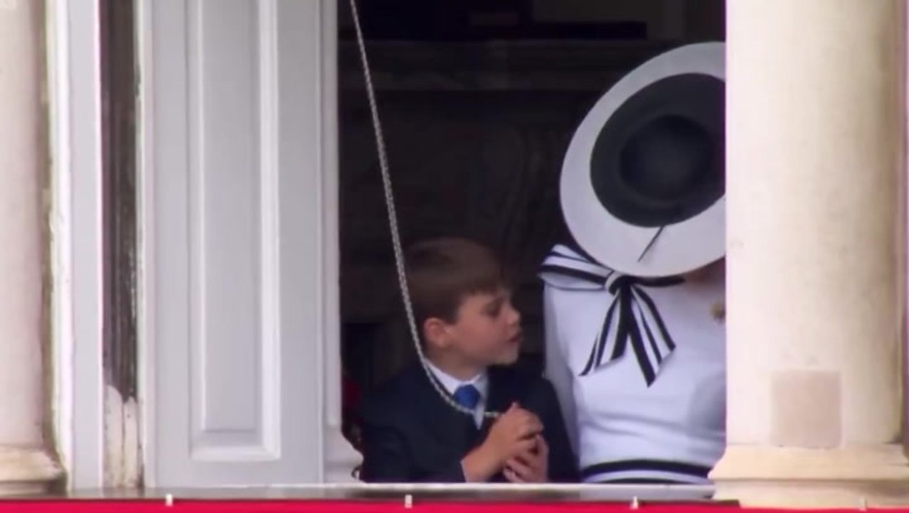 Prince Louis plays with Buckingham Palace curtains during Trooping the Colour parade