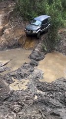 Big Log of Wood Slams Into Car's Engine While Driving Down Pothole