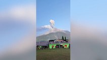 Footballers continue game as Indonesian volcano spews ash behind them