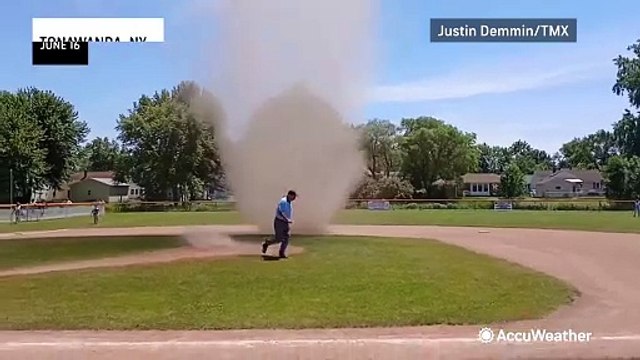Large dust devil interrupts a Father's Day baseball game