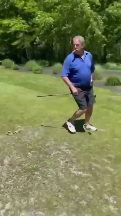 Golf man  shaking snake