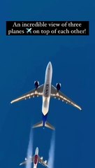 Incredible sight! A ** Three planes perfectly aligned while flying. Kuwait Airlines and Emirates Airlines in a mesmerizing mid-air dance, all captured by another international flight below. Aviation magic at its finest!