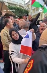Muslim woman burns the French flag. If you hate Europe so much, why do you still keep coming to Europe?